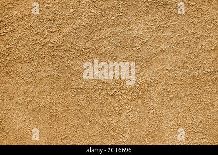 Abstract rough beige texture. Architectural abstract background. Plastered building wall. Stock Photo