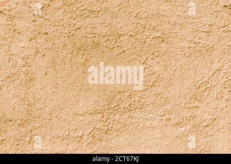 Abstract rough beige texture. Architectural abstract background. Plastered building wall. Stock Photo