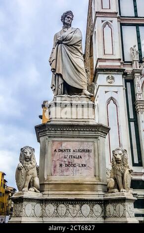 The Statue of Dante Alighieri located in Piazza Santa Croce, next to Basilica of Santa Croce. Florence, Italy Stock Photo
