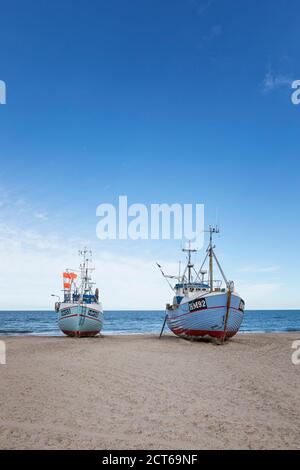 Fishing boats towed to Thorup beach at Jammerbugt bay on the Danish North Sea coast Stock Photo