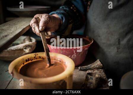 Woman making Horezu ceramics, a unique type of Romanian pottery, UNESCO Cultural Heritage List, Wallachia, Romania Stock Photo