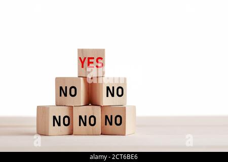 The words yes or no on wooden blocks. Choice, decision or positive attitude in business or personal life concept.