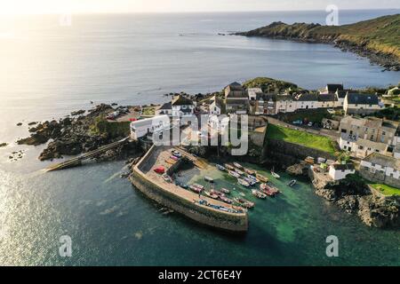 COVERACK, CORNWALL, UK - SEPTEMBER 12, 2020. An aerial landscape  image by drone of the picturesque Cornish fishing village and harbour of Coverack Stock Photo