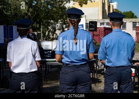 Oranienburg, Germany. 21st Sep, 2020. Two policewomen and one police officer stand together at a press event on the premises of the former police station in Oranienburg (Brandenburg). On the area of the old and dilapidated former police station, the planned dormitory of the police academy is to be built. Credit: Paul Zinken/dpa/ZB/dpa/Alamy Live News Stock Photo