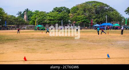 Sri Lankan people playing cricket in front of the Dutch Fort, Negombo, Sri Lanka, Asia Stock Photo