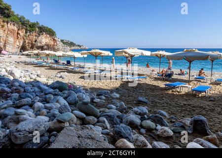 Beaches of Greece, Mylopotamos beach, sunshades and sun chaise lounges on the beach, Pelion, Volos district