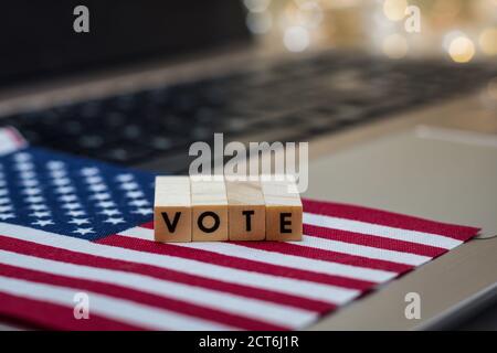 VOTE letter blocks concept on laptop keyboard
