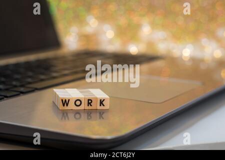 WORK letter blocks online virtual concept on laptop keyboard Stock Photo
