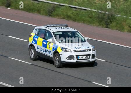 A Ford Police car patrolling on the M6 motorway near Preston in Lancashire, UK Stock Photo