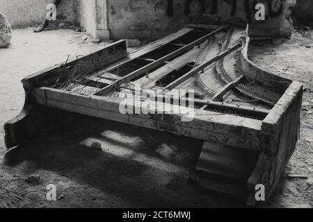 old piano in an abandoned house Stock Photo