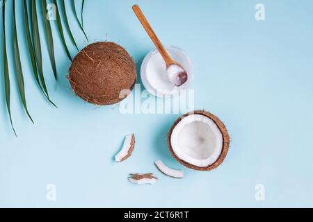 Coconuts on blue background, top view. Stock Photo