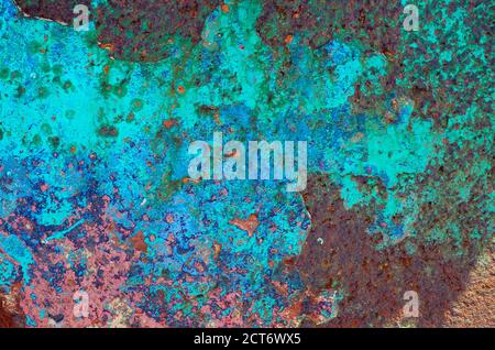 weathered blue flaky paint on old metal boat hull wreck, north norfolk, england Stock Photo