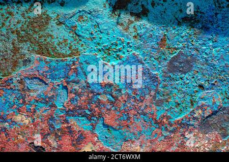 weathered blue flaky paint on old metal boat hull wreck, north norfolk, england Stock Photo