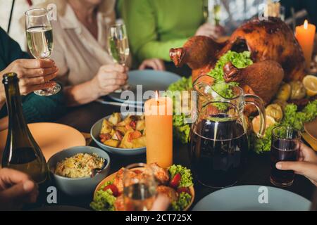 Served table photo thanks giving occasion dinner garnished turkey family generation gathering evening living room indoors Stock Photo