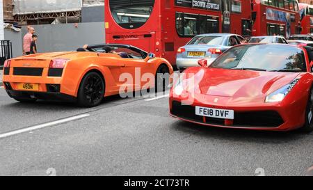 Orange Lamborghini. People watch supercars, in Sloane Street for Supercar  Sunday, Knightsbridge, London, UK Stock Photo - Alamy