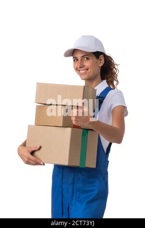 Portrait of happy smiling delivery woman with stack of boxes showing thumb up isolated on white background Stock Photo