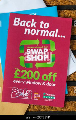 unsolicited mail junk mail on doormat - back to normal Safestyle window & door swap shop Stock Photo