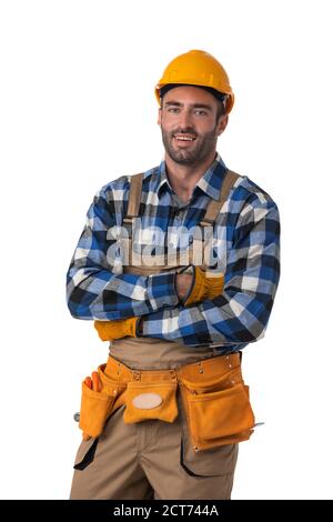 Portrait of contractor worker in coveralls and hardhat with arms crossed isolated on white background Stock Photo
