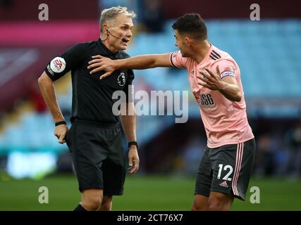 Sheffield United's John Egan reacts after getting sent off by referee Graham Scott during the Premier League match at Villa Park, Birmingham. Stock Photo