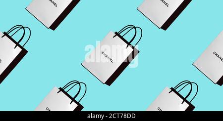 Seamless pattern of white shopping bags with the CHANEL logo on a blue background. Concept of shopping, gifts, buyer, discounts. Top view, background, Stock Photo