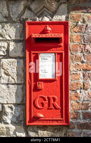 A UK red cast iron wall box post box from the reign of King George VI (GR), York, UK Stock Photo
