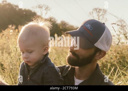 Toddler with father outside Stock Photo