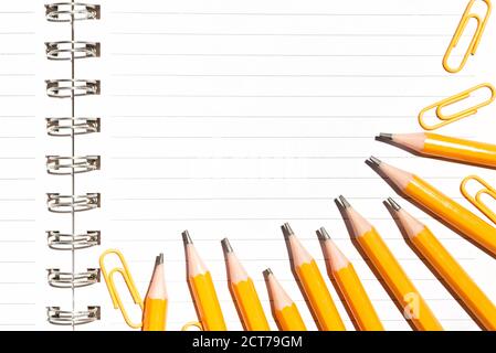 Notebook and yellow pencils. Minimal school or office supplies Stock Photo