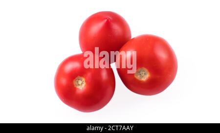 Three whole red tomatoes on a white background in isolation Stock Photo