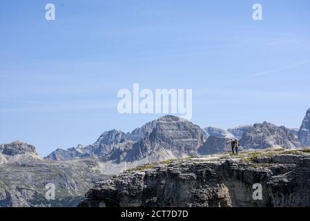 Hikers enjoying the panorama on Monte Piano in the Sexten Dolomites in South Tyrol, Italy. Stock Photo