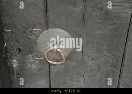 Detail of ancient door knocker in the shape of a ring Stock Photo