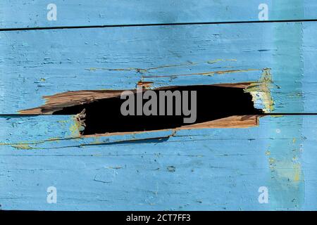blue wooden wall with a hole. background for design Stock Photo