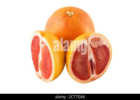 One whole grapefruit and also sliced pieces of grapefruit on a white background Stock Photo