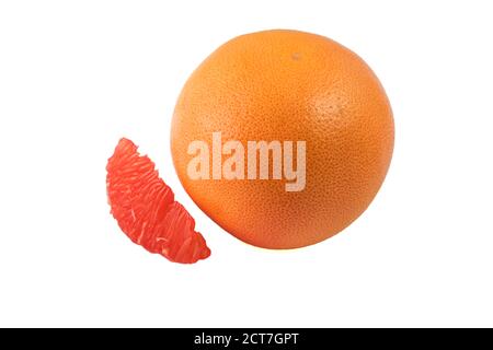 One whole grapefruit and also sliced pieces of grapefruit on a white background Stock Photo