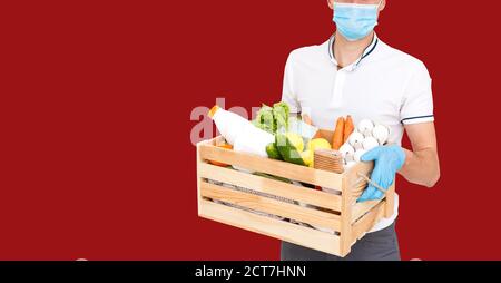 https://l450v.alamy.com/450v/2ct7hnn/delivery-man-in-mask-and-gloves-bring-fresh-food-to-customers-home-stay-home-online-shopping-concept-red-background-2ct7hnn.jpg