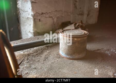 NEWARK, NEW JERSEY - JULY 17th, 2020: An Antique Can of Early's Cement Liquid Sits Forgotten in the Abandoned Proctor's Palace Theatre in Newark New J Stock Photo