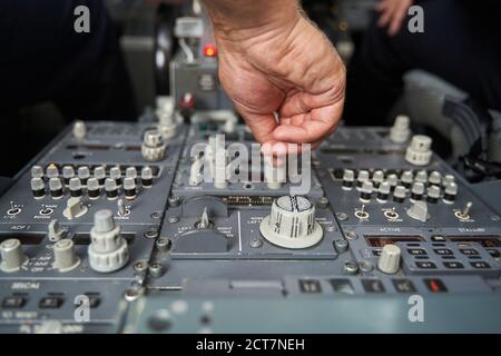 Pushing the buttons and gaining speed in the plane Stock Photo