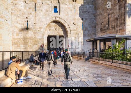 Police officers on duty near Damascus Gate at the old city of Jerusalem. They were built in 16th century and are a typical example of Muslim architect Stock Photo