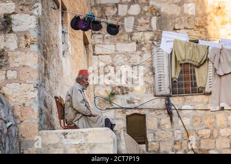 Ethiopian Orthodox priest at the church at the Ethiopian section of the Holy Sepulcher in Jerusalem. Jerusalem, Israel - April 19 2018 Stock Photo