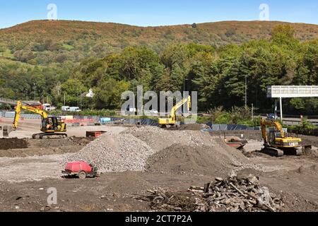 Taffs Well, near Cardiff, Wales - September 2020: Mechanical diggers working on land clearance work in Taffs Well building a new train depot Stock Photo