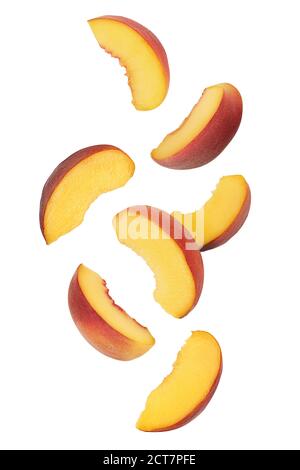 falling ripe peach slices isolated on white background Stock Photo