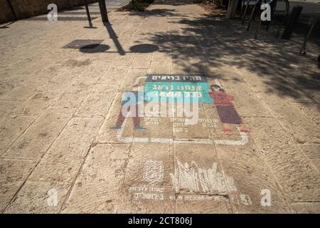 jerusalem, israel. 18-09-2020. Printing on the floor of a pedestrian path with guidelines for maintaining health during the Corona virus on behalf of