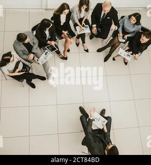 top view. the project Manager and the working group discussing financial data Stock Photo