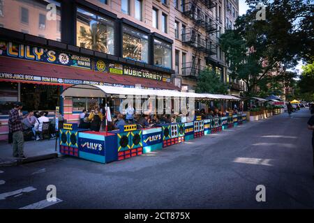 New York, NY / USA - September 19 2020: busy outdoor restaurant in East Village, Manhattan. Covid outdoor dining Stock Photo