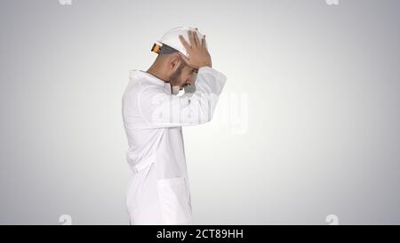 Science engineer walking and putting helmet on Safety concept on Stock Photo