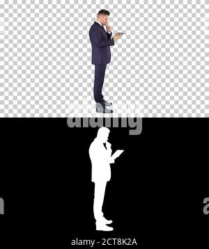 Smart senior businessman using a technology tablet, Alpha Channe Stock Photo