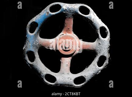 Old Faucet Knob on Black Background. Stock Photo