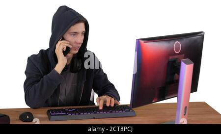 Experienced hacker answers someones call on white background. Stock Photo