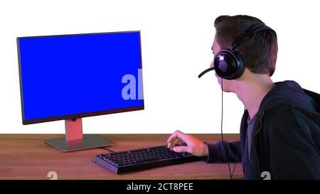 Gamer talking about the game on the screen to camera on white ba Stock Photo