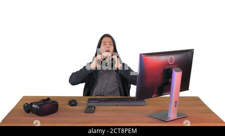 Stressed tired out of work hacker looking at pc monitor on white Stock Photo