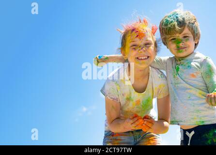 Two kids with face smeared with colors Stock Photo